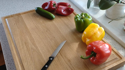 Schneidebrett Mauritius Zweiseitiges Massivholzbrett mit Saftrillen und Griff